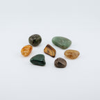 Assorted small stones on a white background