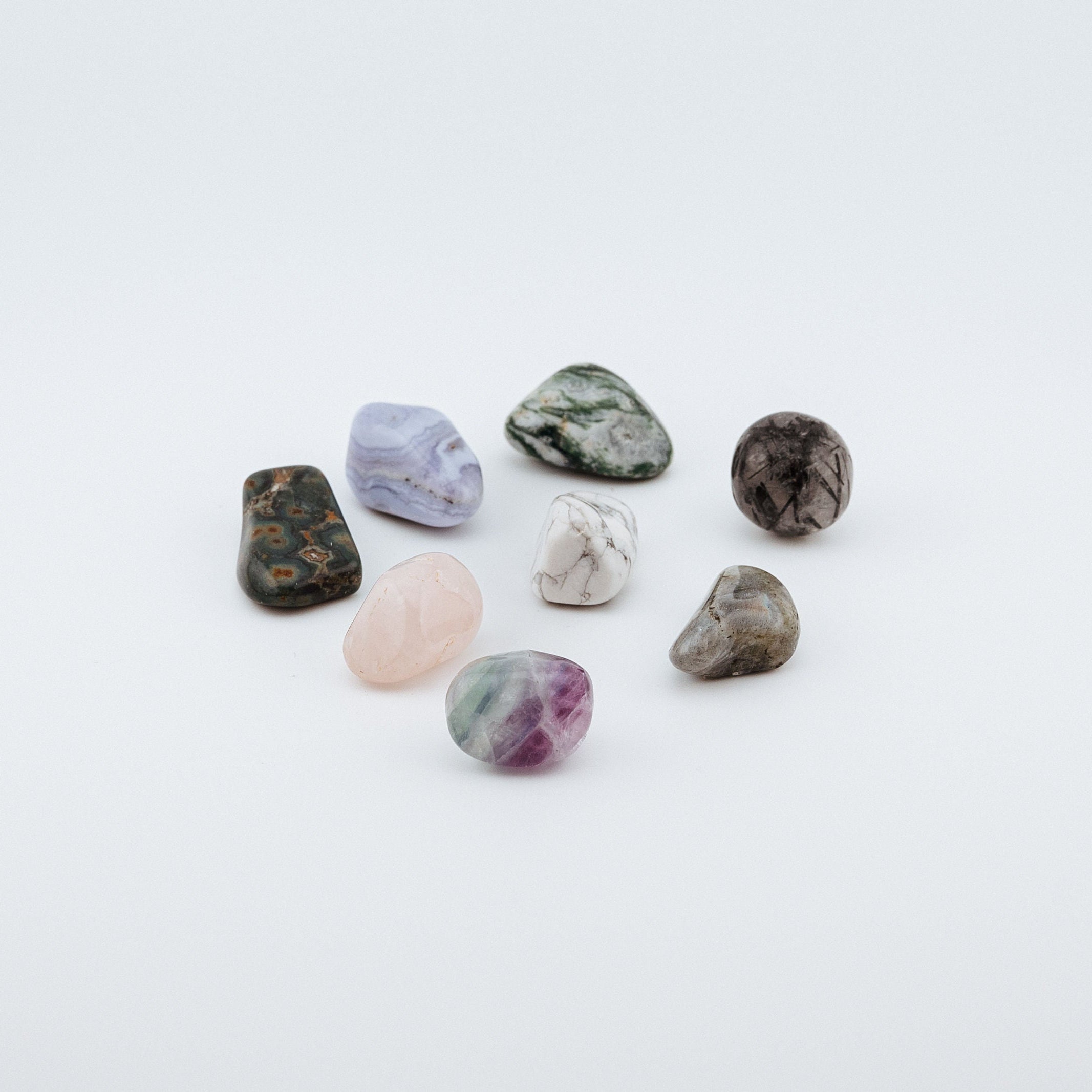 Collection of various textured stones on a white background