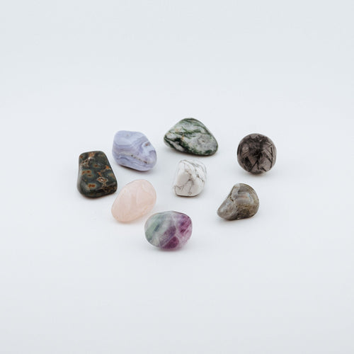 Collection of various textured stones on a white background