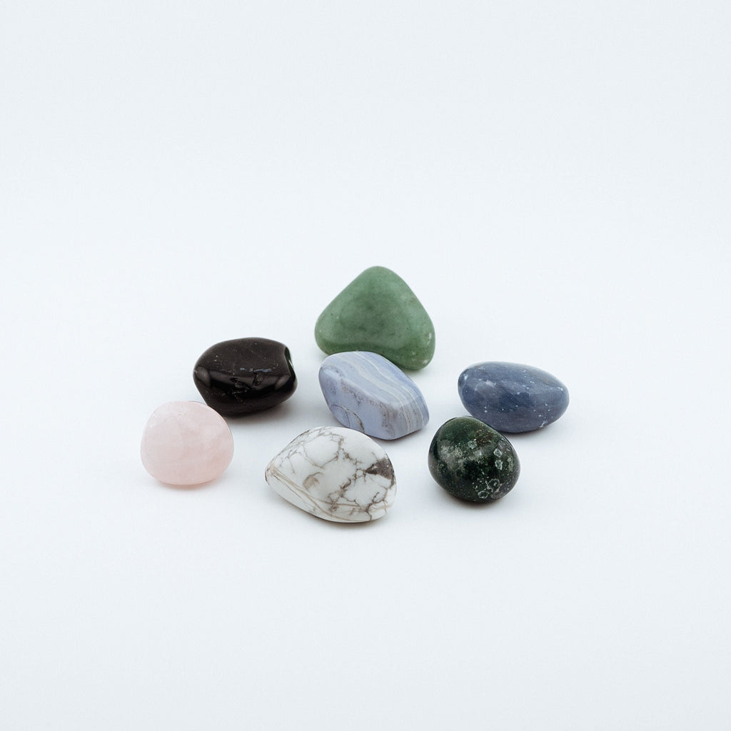 Collection of multicolored crystals on a white background
