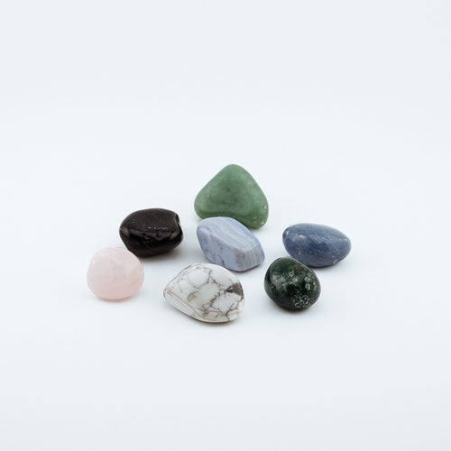 Collection of multicolored crystals on a white background