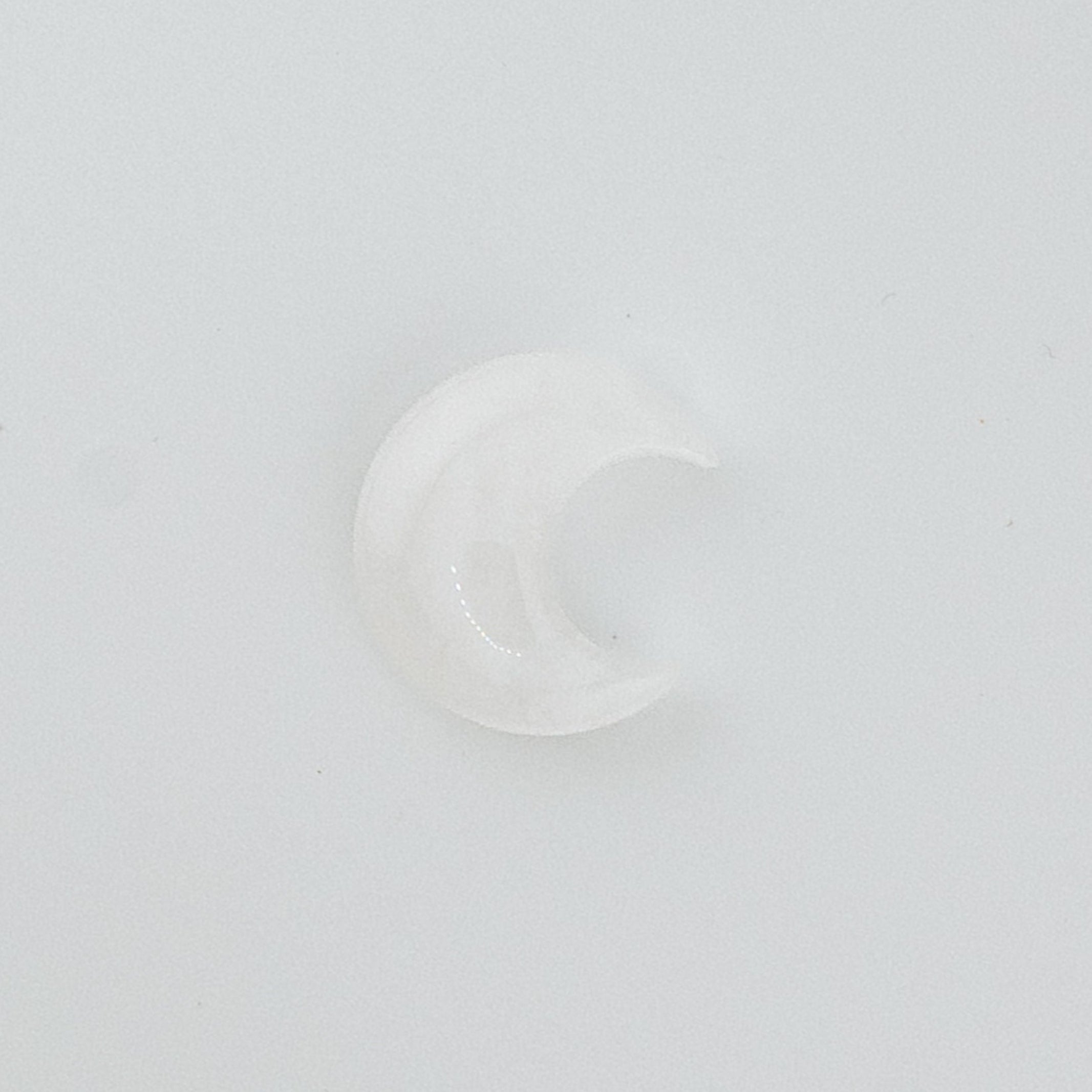 Clear moon-shaped crystal on a white background