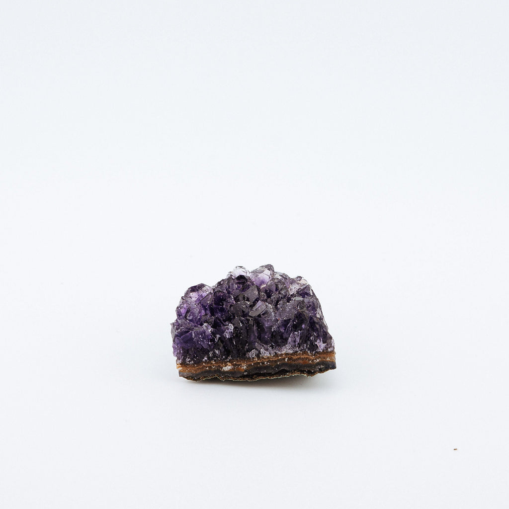 Purple crystal on a white background