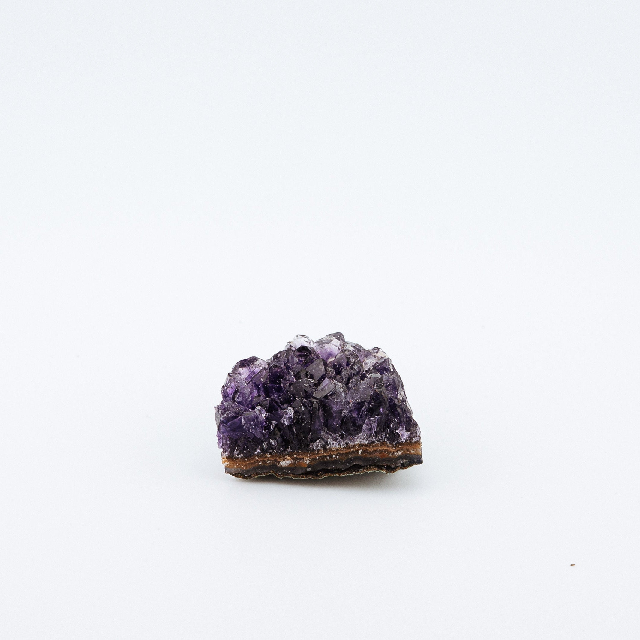 Purple crystal on a white background