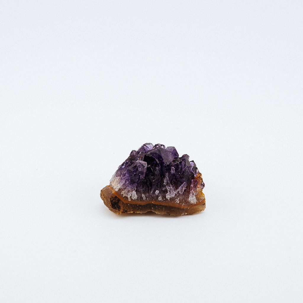 Purple crystal on a white background