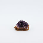 Purple crystal on a white background