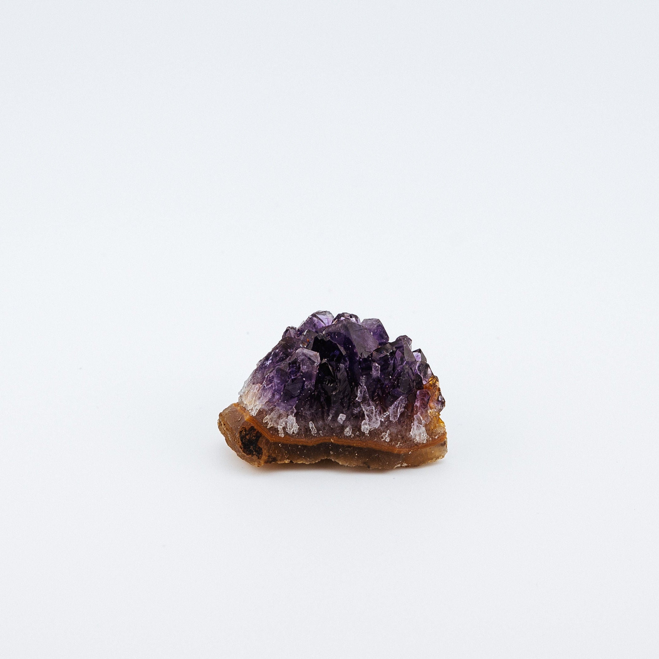 Purple crystal on a white background