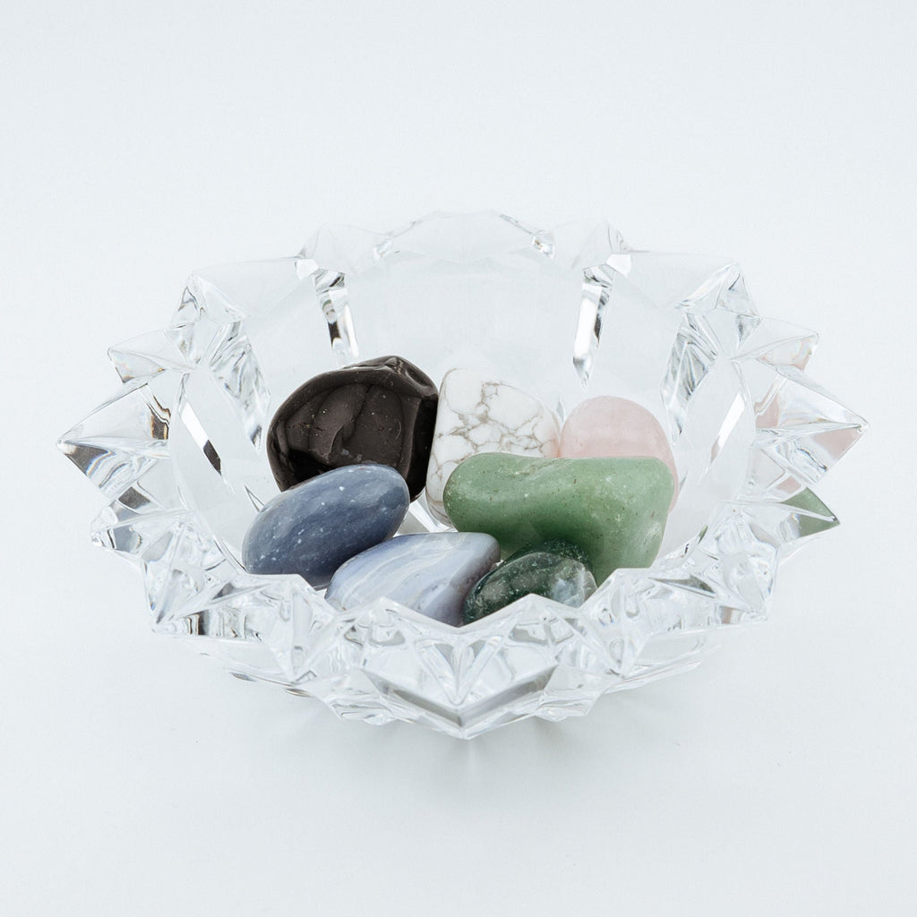 Clear bowl with stones inside on a white background
