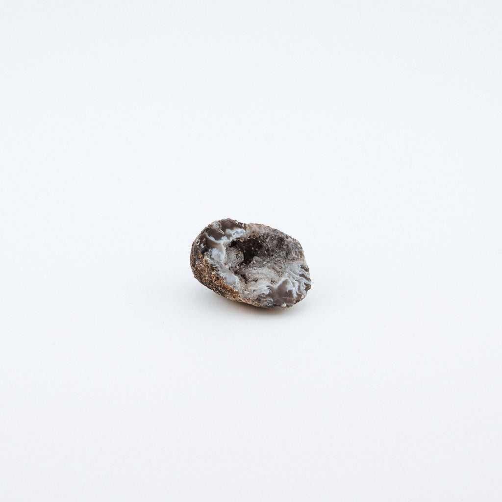Small brown geode on a white background