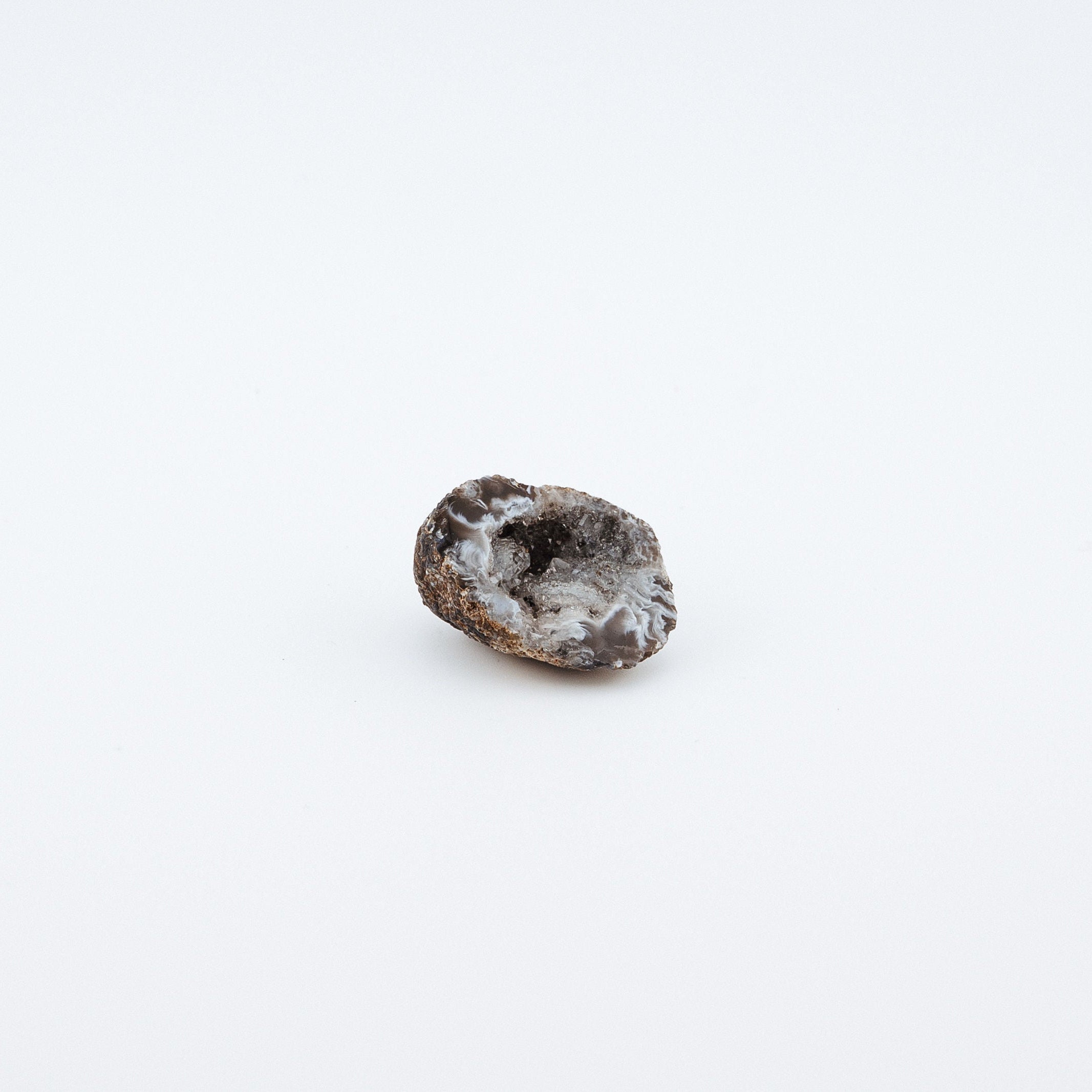 Small brown geode on a white background