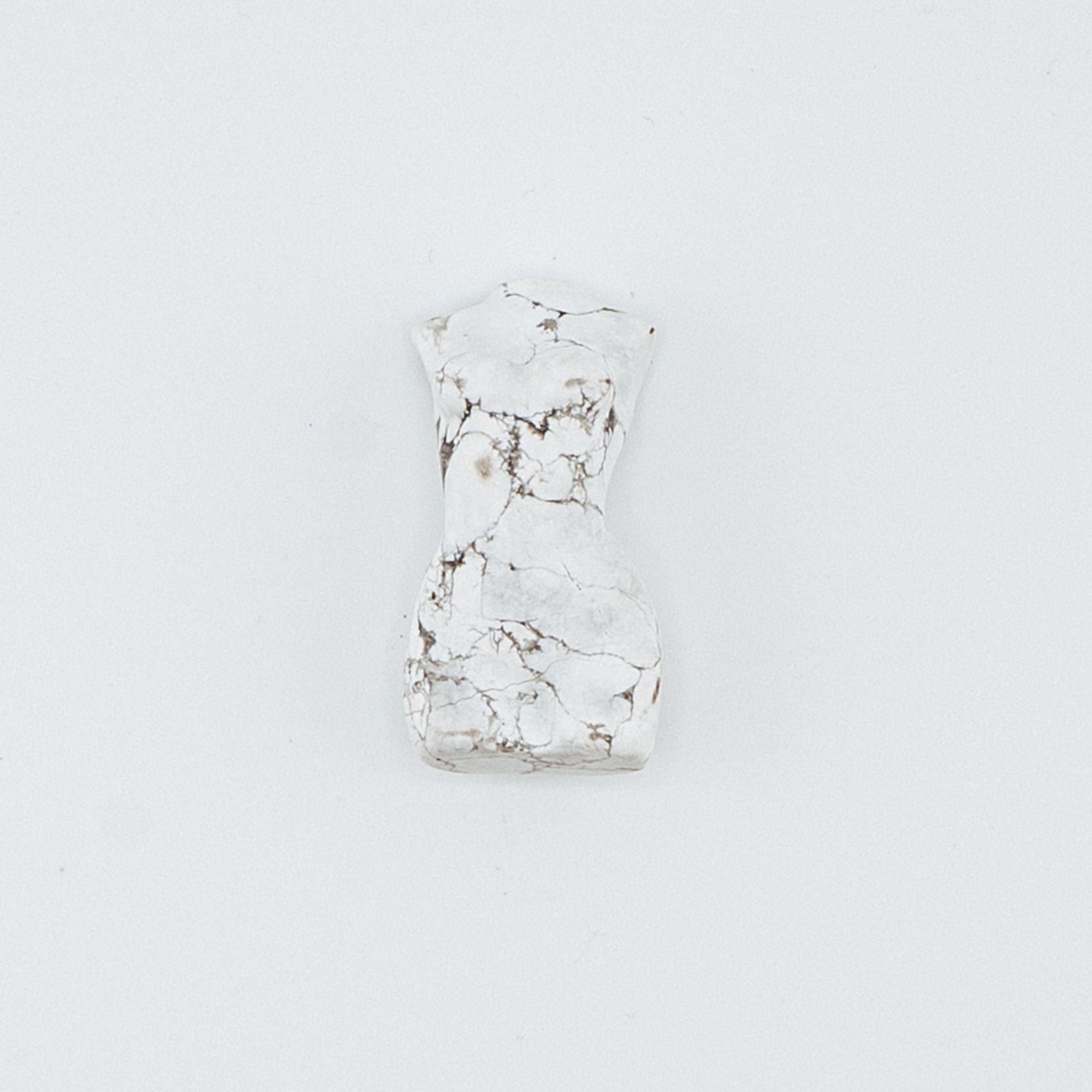 Small white carving on a light gray background