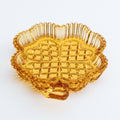 Orange glass dish with textured surface on a white background