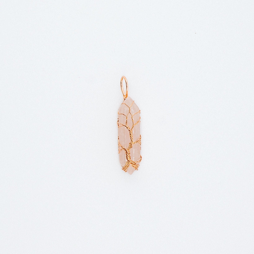 Gold pink pendant on a light gray background