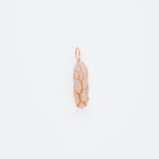 Gold pink pendant on a light gray background