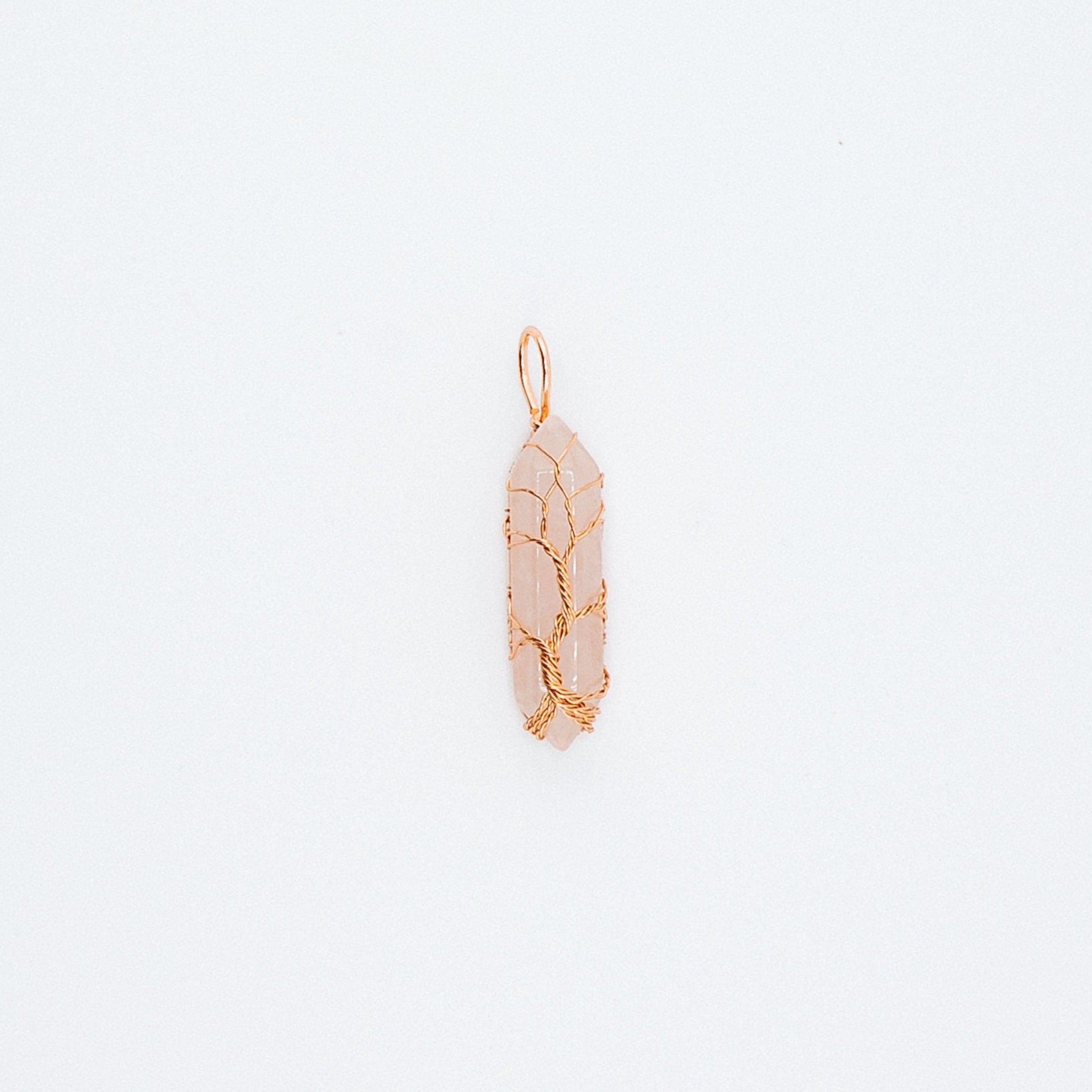 Gold pink pendant on a light gray background