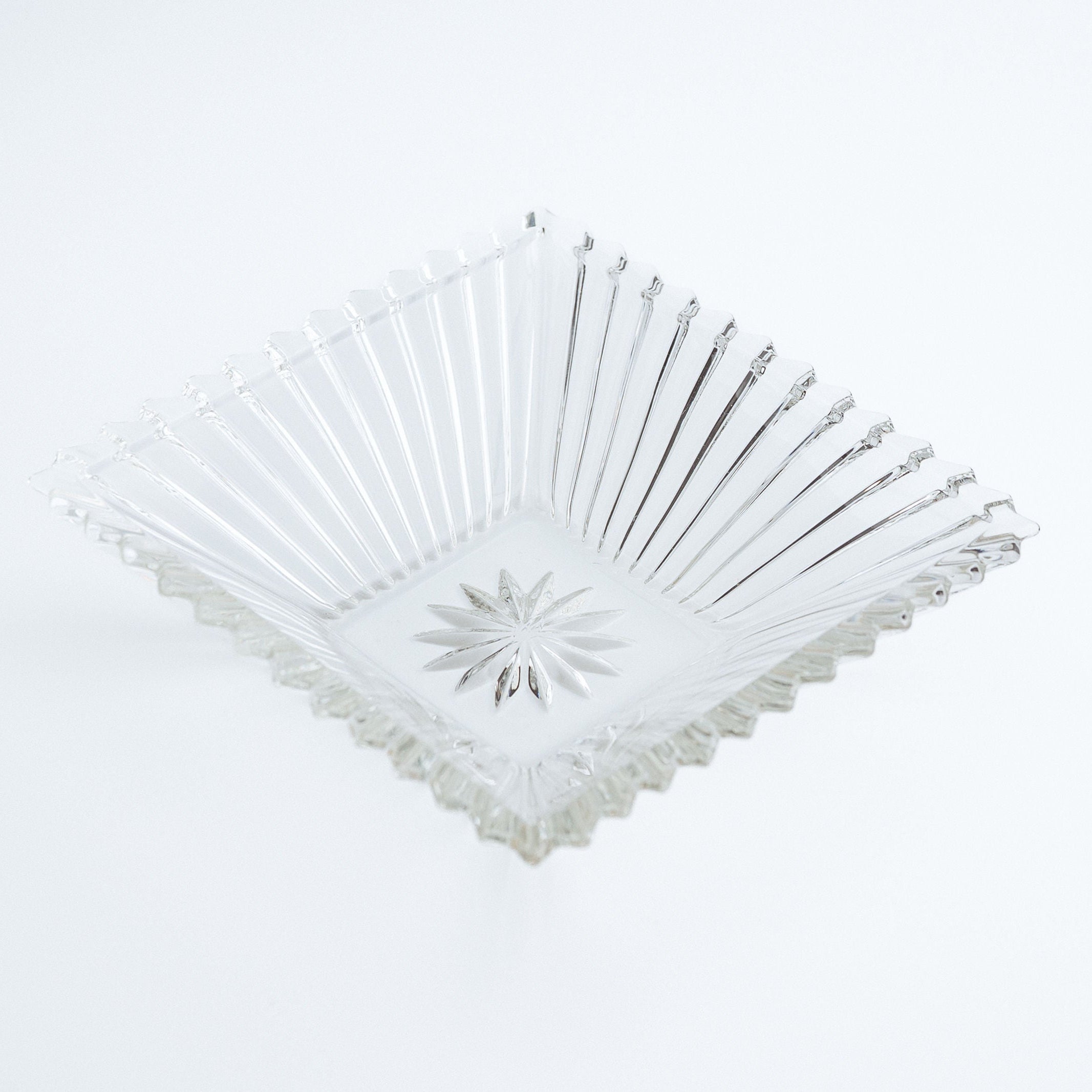 Clear square bowl on a white background